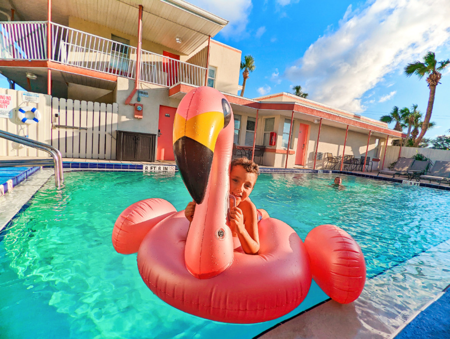 Taylor Family with Flamingo floatie in Swimming Pool at the Local Hotel St Augustine Florida 1