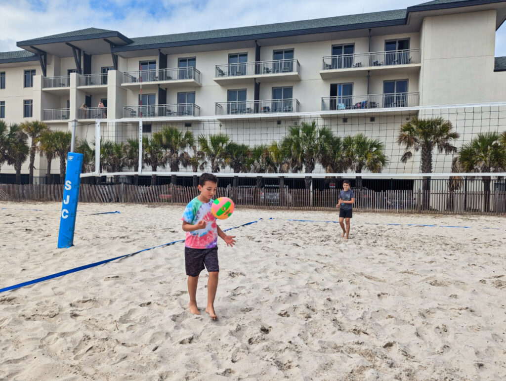 Taylor Family at Beach Volleyball Court at St Johns County Ocean Park and Pier St Augustine Beach Florida 1