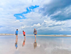 Taylor Family walking on Butler Beach with Storm Clouds St Augustine Florida 1